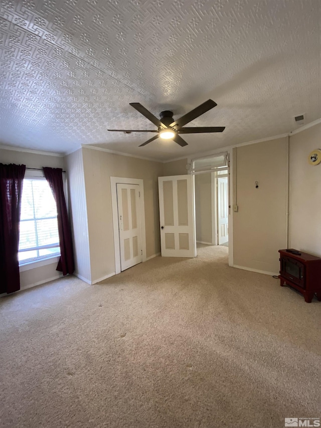 85 S Main, Paradise Valley, NV 89426 - carpeted empty room with a ceiling fan, crown molding, baseboards, and a textured ceiling