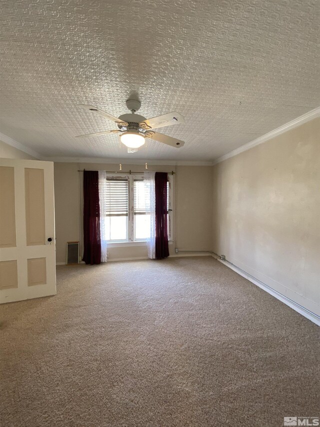 85 S Main, Paradise Valley, NV 89426 - unfurnished room with carpet floors, crown molding, a ceiling fan, and baseboards