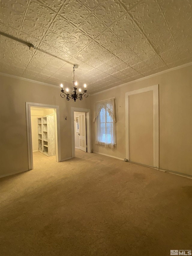 85 S Main, Paradise Valley, NV 89426 - unfurnished dining area featuring ornamental molding, a chandelier, carpet, and an ornate ceiling