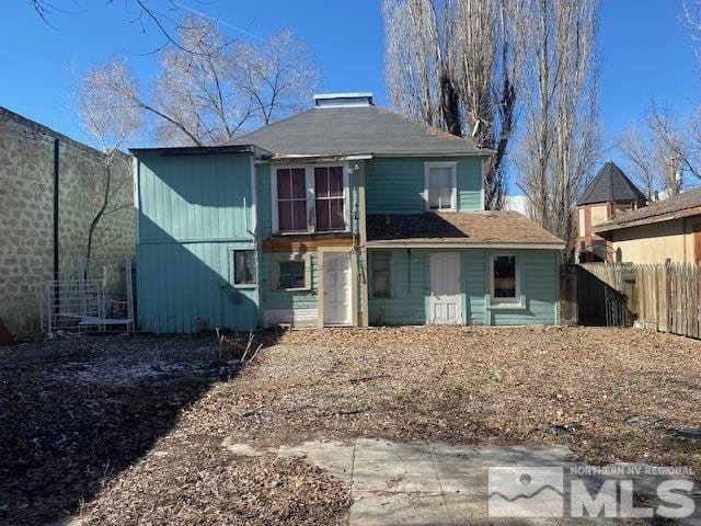 85 S Main, Paradise Valley, NV 89426 - rear view of house featuring fence