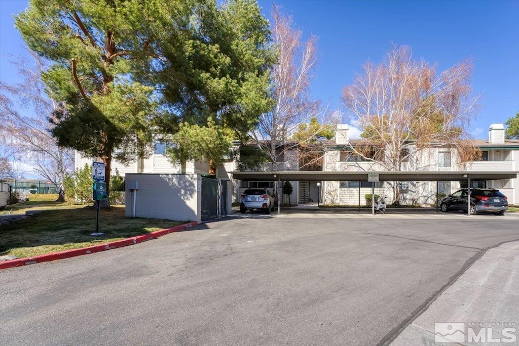 2624 Sunny Slope Dr Unit 12, Sparks, NV 89434 - view of front of home featuring covered parking and a chimney