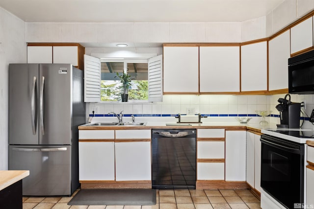 1360 Dartmouth Dr, Reno, NV 89509 - kitchen with black appliances, a sink, white cabinets, light countertops, and backsplash