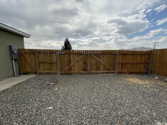 view of yard with a gate and fence