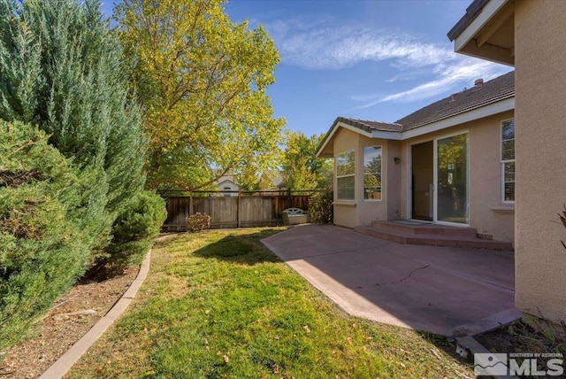 view of yard with a patio area