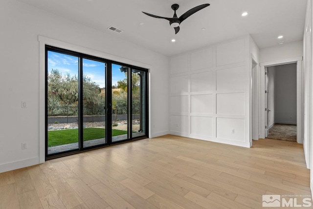 4090 Goodsell Ln, Reno, NV 89523 - unfurnished room featuring light wood-style flooring, ceiling fan, recessed lighting, baseboards, and a decorative wall