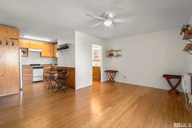 2450 Lymbery St Unit 206, Reno, NV 89509 - kitchen featuring white gas stove, light wood-style flooring, and ceiling fan