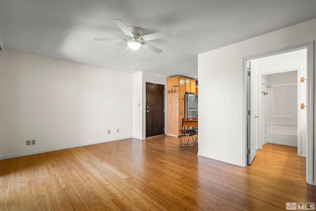 2450 Lymbery St Unit 206, Reno, NV 89509 - spare room with ceiling fan, light wood-style floors, and baseboards