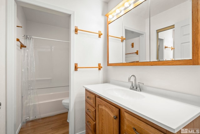 2450 Lymbery St Unit 206, Reno, NV 89509 - bathroom featuring wood finished floors, vanity, toilet, and shower / tub combo