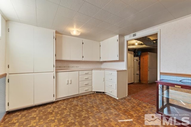 kitchen with light countertops and white cabinetry