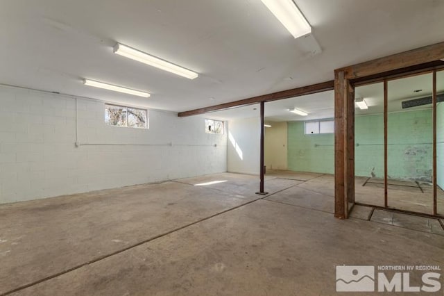 below grade area with concrete block wall