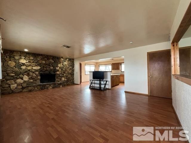 1036 Arrowhead Dr, Gardnerville, NV 89460 - unfurnished living room with a fireplace and wood finished floors