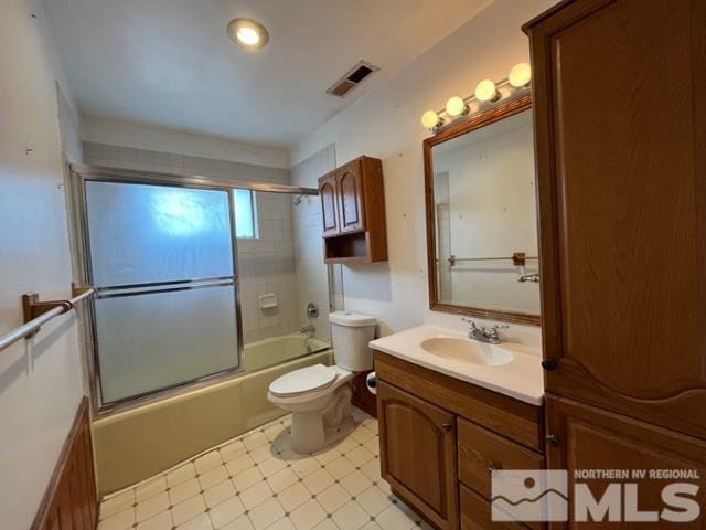 1036 Arrowhead Dr, Gardnerville, NV 89460 - bathroom featuring vanity and bath / shower combo with glass door