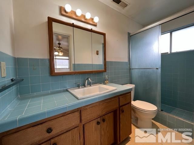 1036 Arrowhead Dr, Gardnerville, NV 89460 - full bath with vanity, a shower stall, and ceiling fan