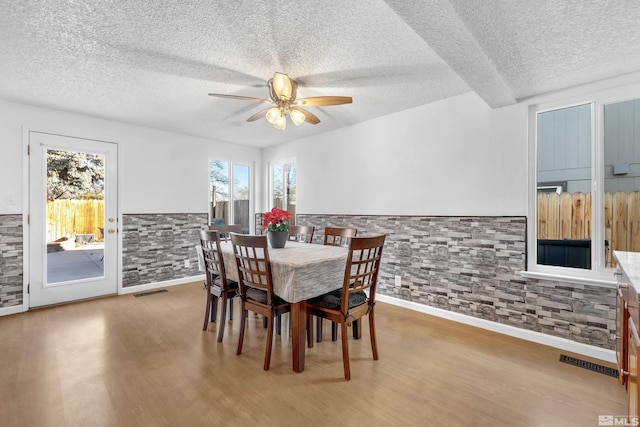 6357 Moon Ridge Ter, Reno, NV 89523 - dining room with a textured ceiling, a ceiling fan, and wood finished floors