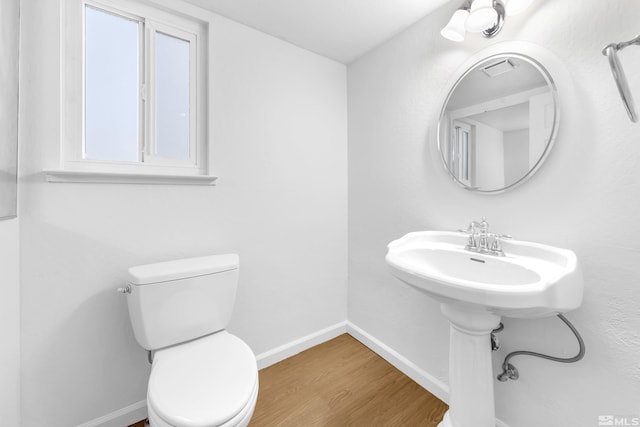 6357 Moon Ridge Ter, Reno, NV 89523 - bathroom with wood finished floors, toilet, and baseboards