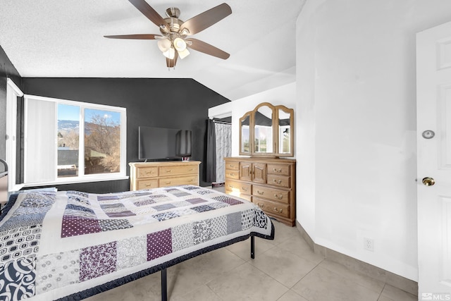 6357 Moon Ridge Ter, Reno, NV 89523 - bedroom featuring lofted ceiling, light tile patterned floors, ceiling fan, and baseboards