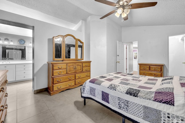 6357 Moon Ridge Ter, Reno, NV 89523 - bedroom with a textured ceiling, vaulted ceiling, light tile patterned flooring, ensuite bathroom, and ceiling fan