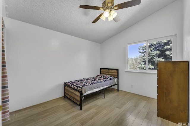 6357 Moon Ridge Ter, Reno, NV 89523 - bedroom with a textured ceiling, wood finished floors, lofted ceiling, and a ceiling fan