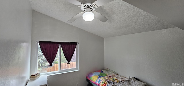 6357 Moon Ridge Ter, Reno, NV 89523 - bedroom featuring lofted ceiling, a textured ceiling, a ceiling fan, and a textured wall