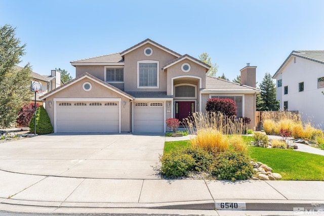 6540 Monticello Ct, Reno, NV 89519 - traditional home featuring driveway, stucco siding, a chimney, an attached garage, and a tiled roof