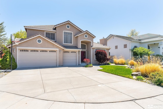 6540 Monticello Ct, Reno, NV 89519 - traditional-style home featuring stucco siding, concrete driveway, a tile roof, and a garage