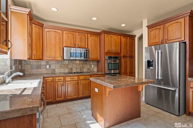 6540 Monticello Ct, Reno, NV 89519 - kitchen with appliances with stainless steel finishes, a sink, a kitchen island, brown cabinetry, and recessed lighting