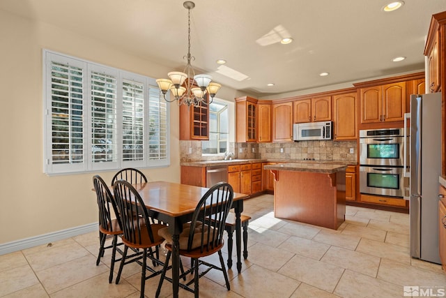 6540 Monticello Ct, Reno, NV 89519 - dining room with a chandelier, recessed lighting, baseboards, and light tile patterned flooring