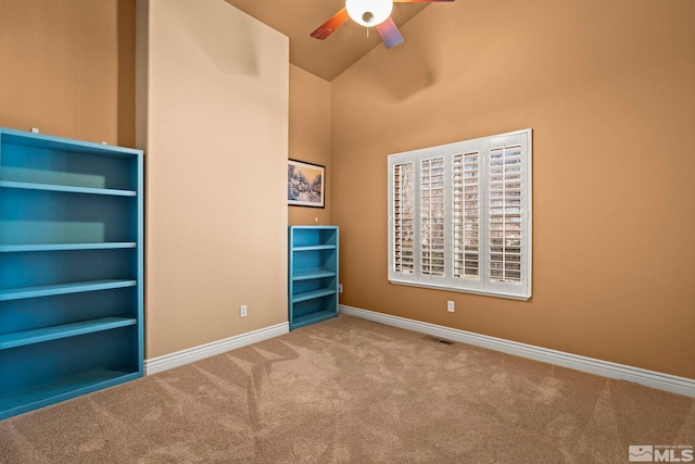 6540 Monticello Ct, Reno, NV 89519 - unfurnished bedroom with carpet, baseboards, ceiling fan, and high vaulted ceiling