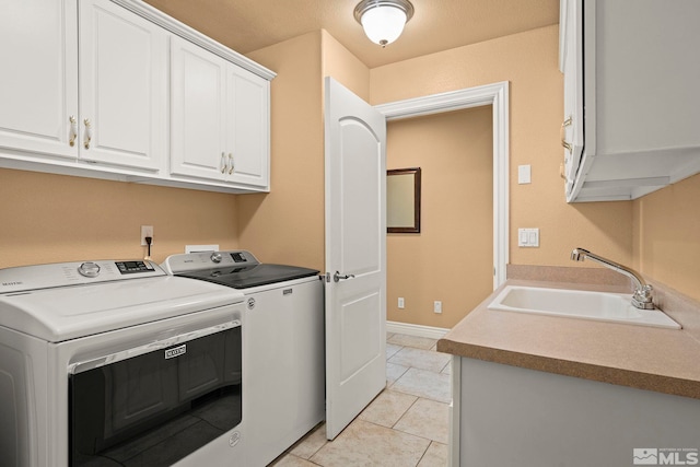6540 Monticello Ct, Reno, NV 89519 - clothes washing area with washing machine and dryer, cabinet space, light tile patterned floors, and baseboards