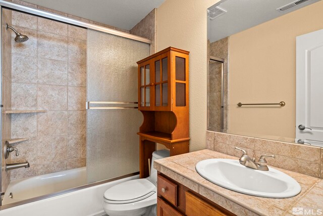 6540 Monticello Ct, Reno, NV 89519 - full bathroom featuring enclosed tub / shower combo, toilet, and vanity