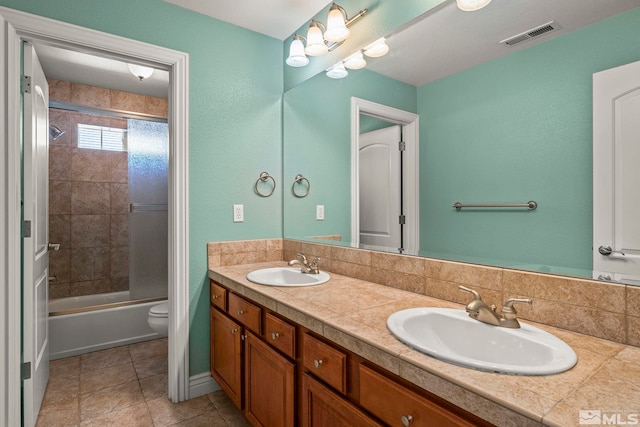 6540 Monticello Ct, Reno, NV 89519 - full bathroom with double vanity, toilet, shower / washtub combination, and tile patterned flooring