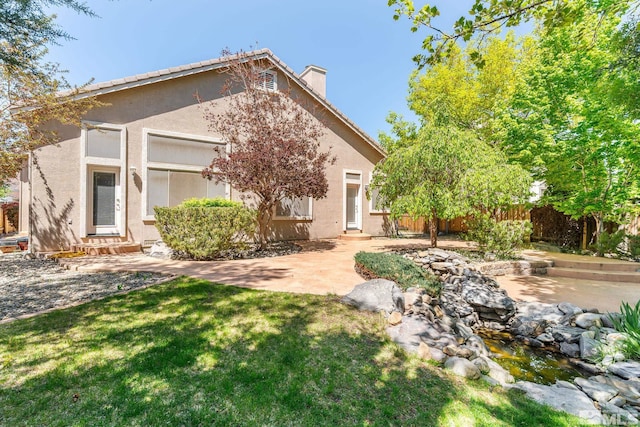 6540 Monticello Ct, Reno, NV 89519 - rear view of house featuring a chimney, entry steps, stucco siding, and a patio area