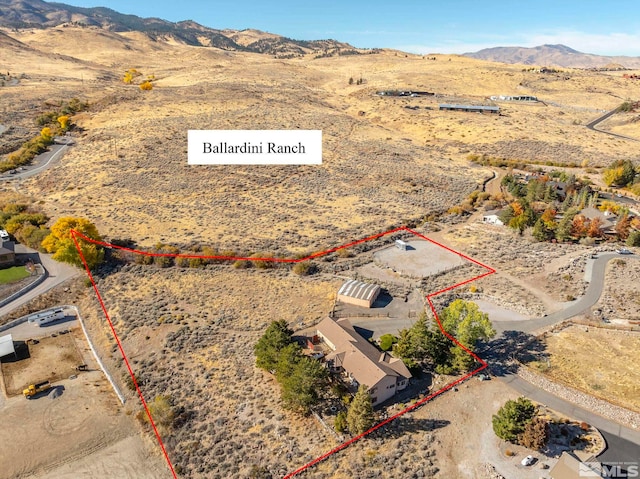 80 Cassas Ct, Reno, NV 89511 - aerial view of sparsely populated area featuring a desert landscape, property parcel outlined, and mountains