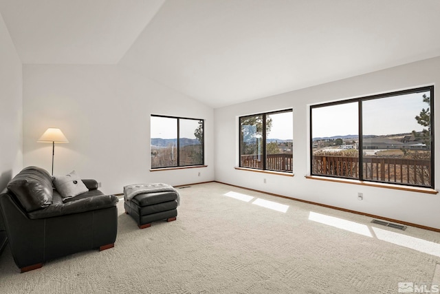 80 Cassas Ct, Reno, NV 89511 - unfurnished living room with carpet floors, vaulted ceiling, and baseboards