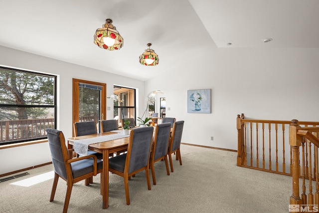 80 Cassas Ct, Reno, NV 89511 - dining area with baseboards, arched walkways, light colored carpet, and vaulted ceiling