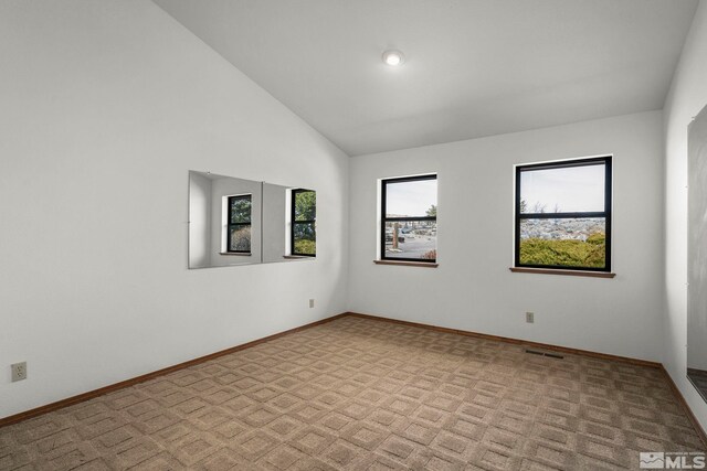 80 Cassas Ct, Reno, NV 89511 - carpeted empty room featuring plenty of natural light, baseboards, and high vaulted ceiling
