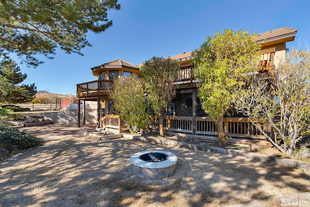 80 Cassas Ct, Reno, NV 89511 - rear view of property with a balcony, an outdoor fire pit, and a patio