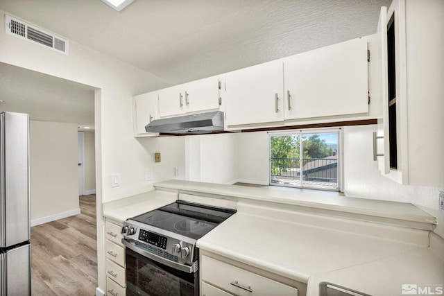 2555 Clear Acre Ln Unit 89/2, Reno, NV 89512 - kitchen with appliances with stainless steel finishes, under cabinet range hood, light wood-style floors, white cabinets, and light countertops