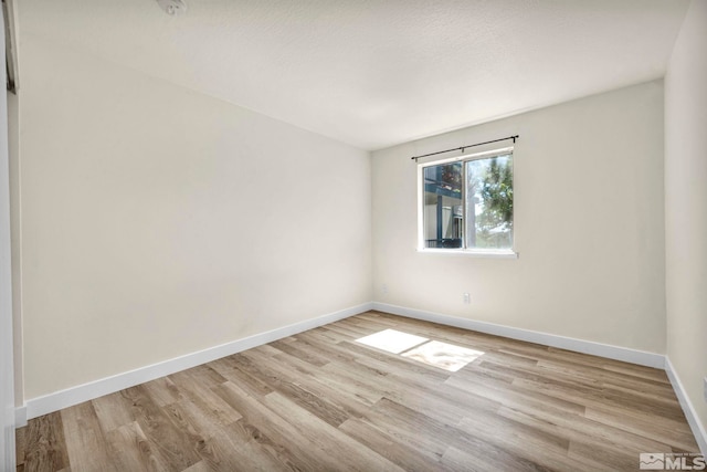 2555 Clear Acre Ln Unit 89/2, Reno, NV 89512 - empty room with wood finished floors and baseboards