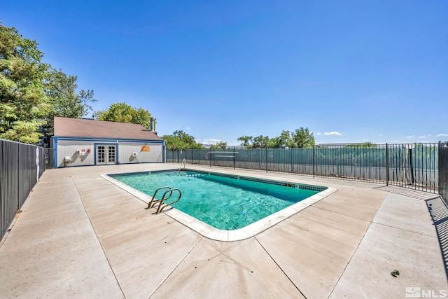 2555 Clear Acre Ln Unit 89/2, Reno, NV 89512 - view of swimming pool with fence, a patio, and french doors