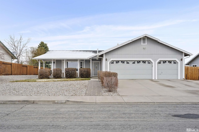 1018 Ringneck, Sparks, NV 89441 - single story home with a garage, fence, concrete driveway, and a porch