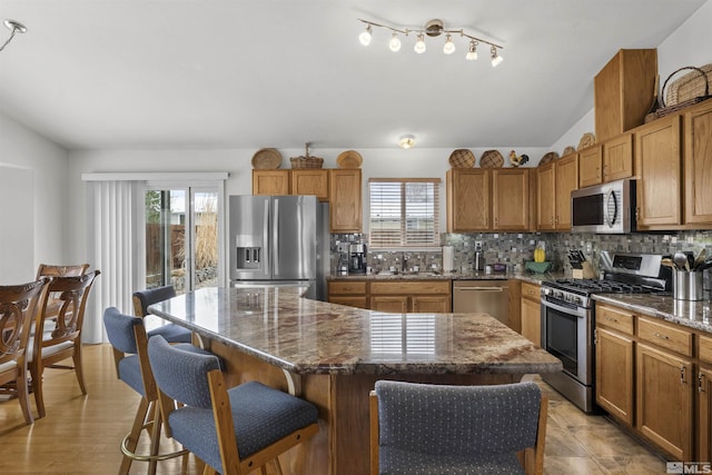 1018 Ringneck, Sparks, NV 89441 - kitchen with stainless steel appliances, plenty of natural light, a sink, and a kitchen island