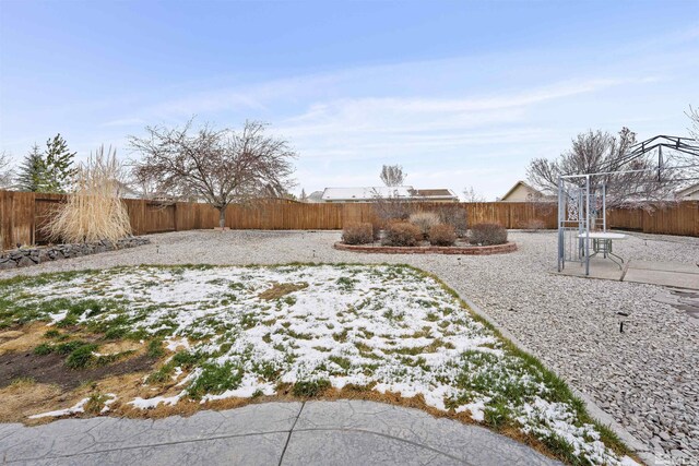 1018 Ringneck, Sparks, NV 89441 - yard layered in snow featuring a fenced backyard and a patio