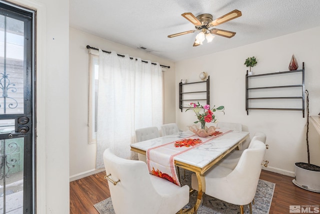 13846 Lear Blvd, Reno, NV 89506 - dining area featuring wood finished floors, ceiling fan, baseboards, and a textured ceiling