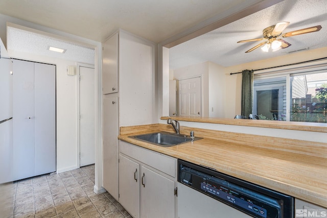 13846 Lear Blvd, Reno, NV 89506 - kitchen with dishwashing machine, a sink, a textured ceiling, light countertops, and a ceiling fan