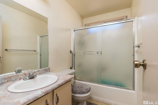 13846 Lear Blvd, Reno, NV 89506 - full bath with toilet, vanity, and bath / shower combo with glass door
