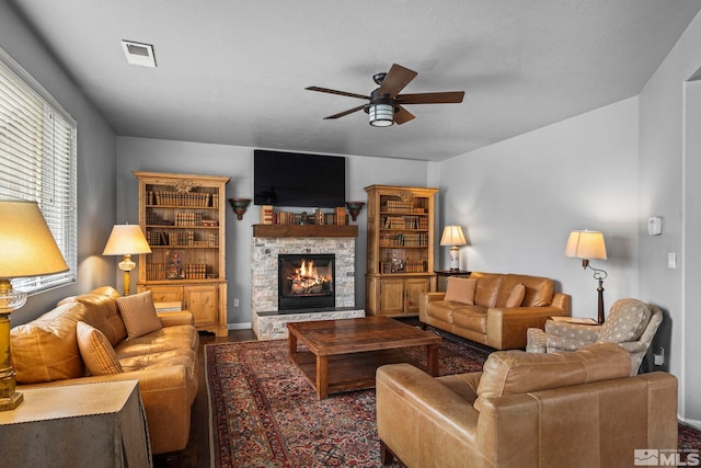 385 Mustengo Ct, Reno, NV 89506 - living room featuring ceiling fan, a fireplace, wood finished floors, and baseboards