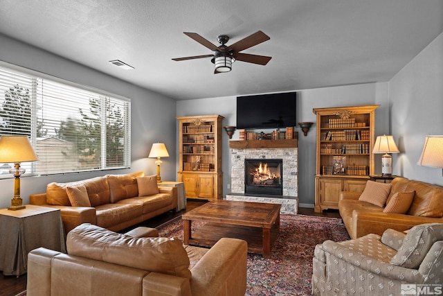 385 Mustengo Ct, Reno, NV 89506 - living area with ceiling fan, wood finished floors, and a stone fireplace