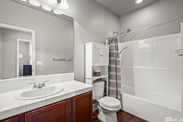 385 Mustengo Ct, Reno, NV 89506 - bathroom featuring toilet, a textured wall, wood finished floors, vanity, and shower / bathtub combination with curtain