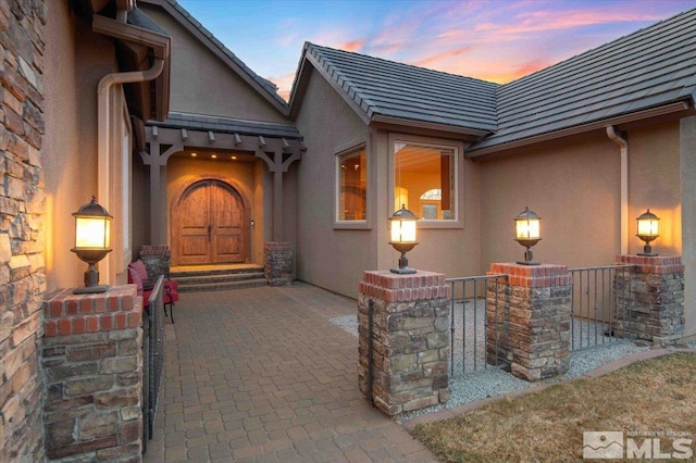 1005 Desert Jewel Ct, Reno, NV 89511 - property entrance with stucco siding